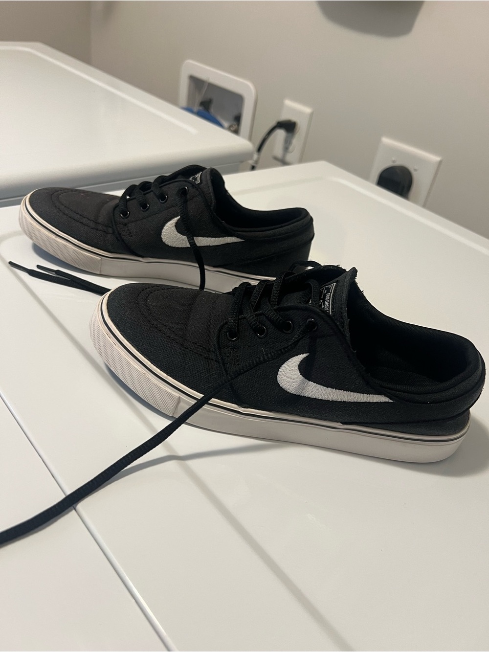 Nike Black Low-Top Sneakers with White Swoosh
